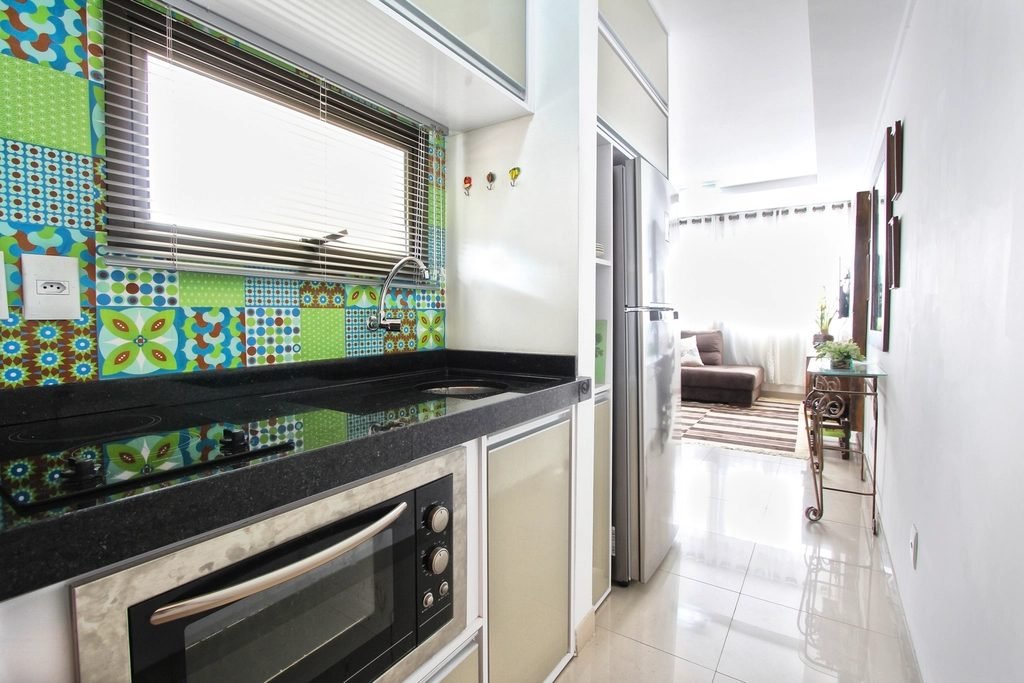Modern kitchen with oven, hob and refrigerator